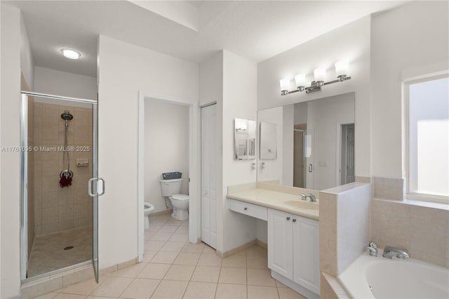 full bathroom with tile patterned flooring, toilet, a stall shower, and vanity