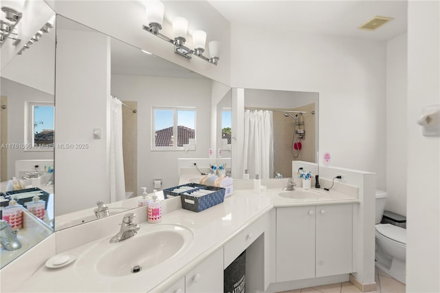 bathroom with a sink, visible vents, curtained shower, and toilet