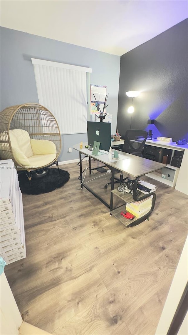 office space featuring wood finished floors and baseboards