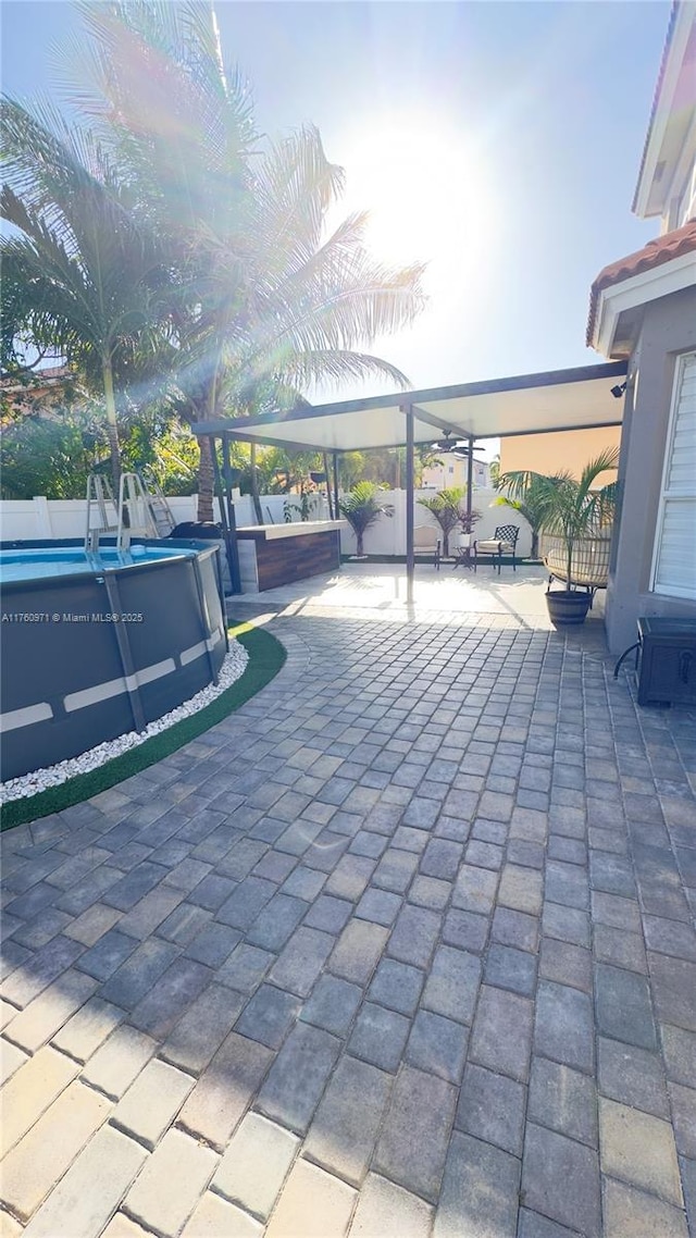 view of patio with an outdoor pool