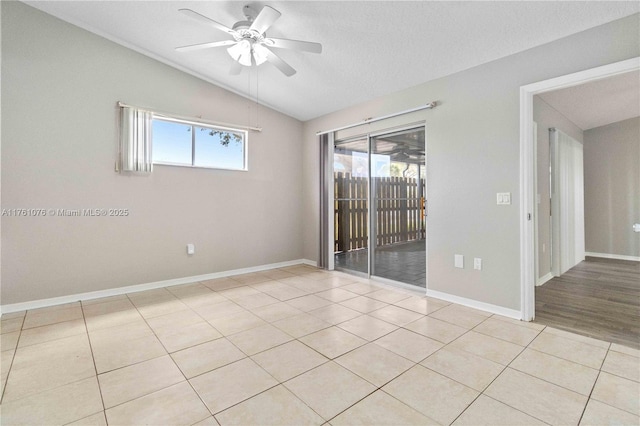 1933 Quail Ridge Ct Unit 1104, Cocoa, FL 32922 - unfurnished room with vaulted ceiling, a ceiling fan, light tile patterned floors, and baseboards