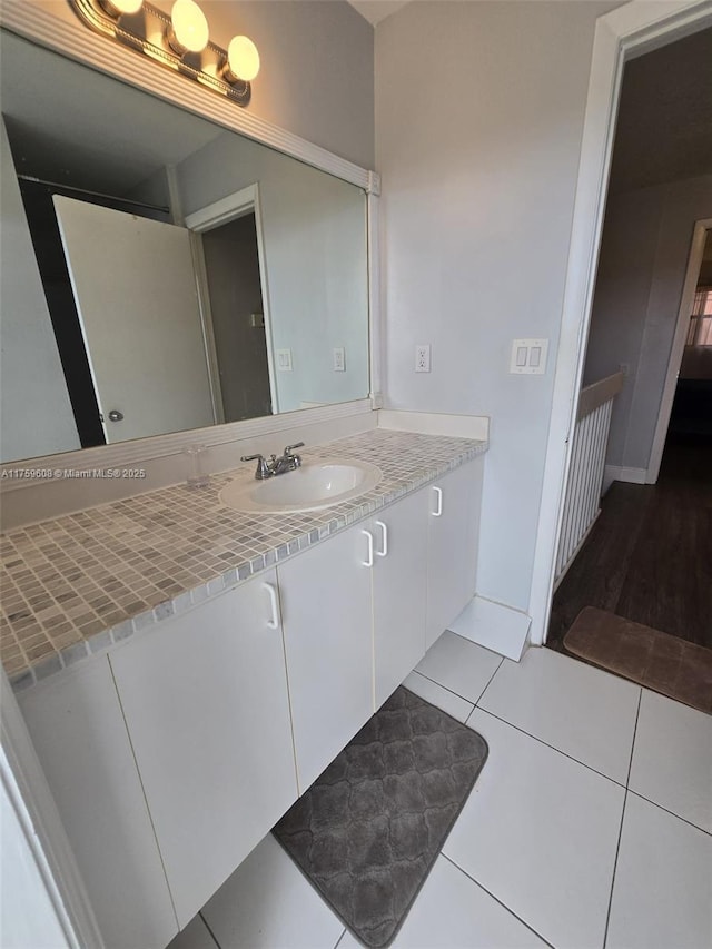 bathroom with vanity and tile patterned flooring