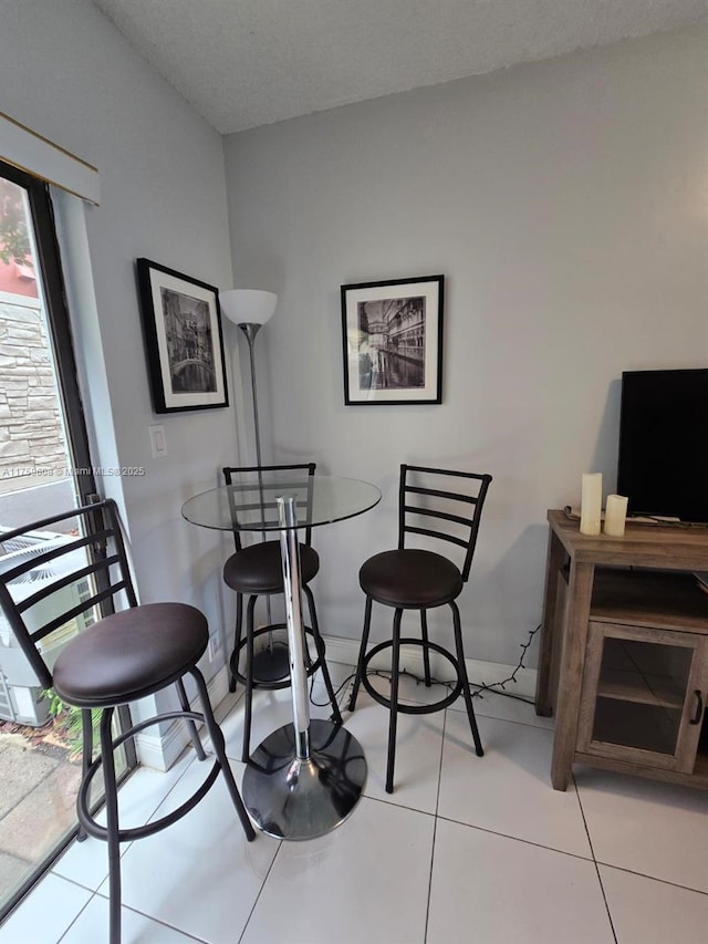 dining room with tile patterned flooring