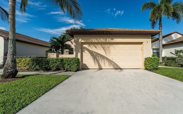 view of front of property with a garage and stucco siding