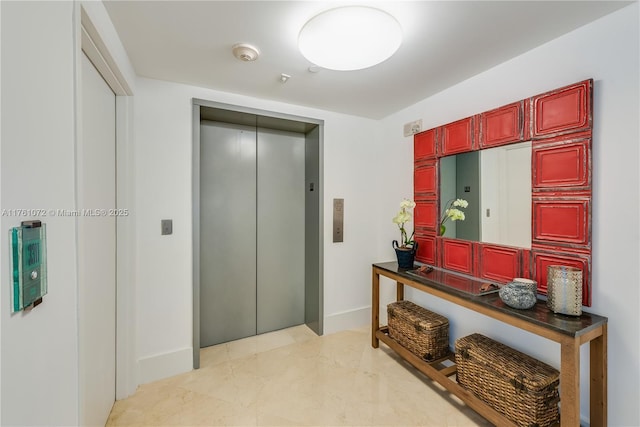 1331 Brickell Bay Dr Unit 3311, Miami, FL 33131 - hallway featuring baseboards, elevator, and marble finish floor