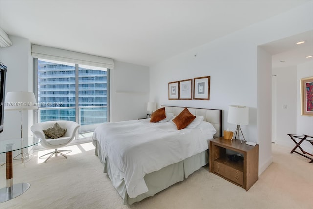 carpeted bedroom with recessed lighting