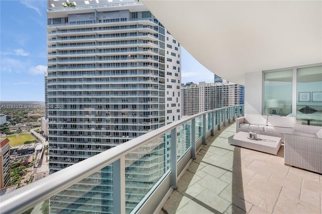 balcony with a city view and outdoor lounge area