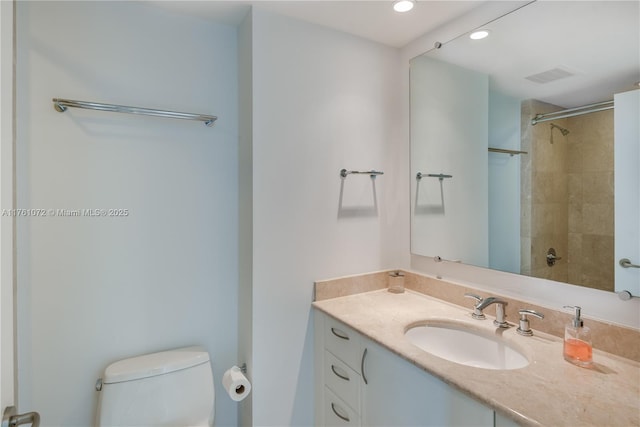 full bathroom with visible vents, toilet, recessed lighting, vanity, and a shower