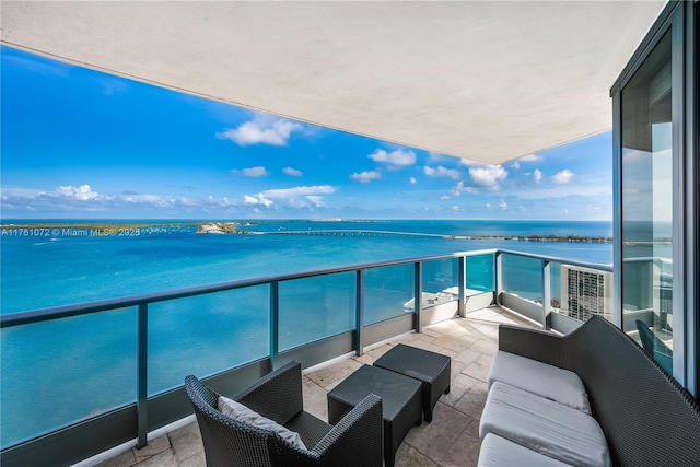 balcony featuring a water view