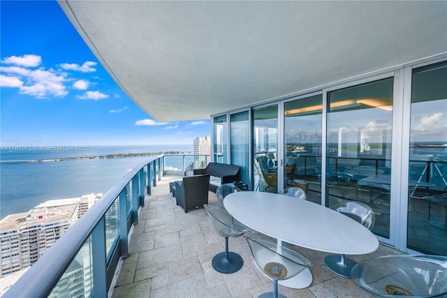 balcony featuring a water view