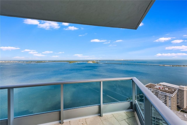 balcony featuring a water view