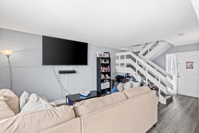 living room featuring stairway and wood finished floors