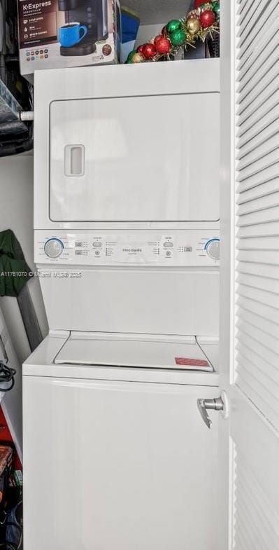 laundry room featuring laundry area and stacked washing maching and dryer