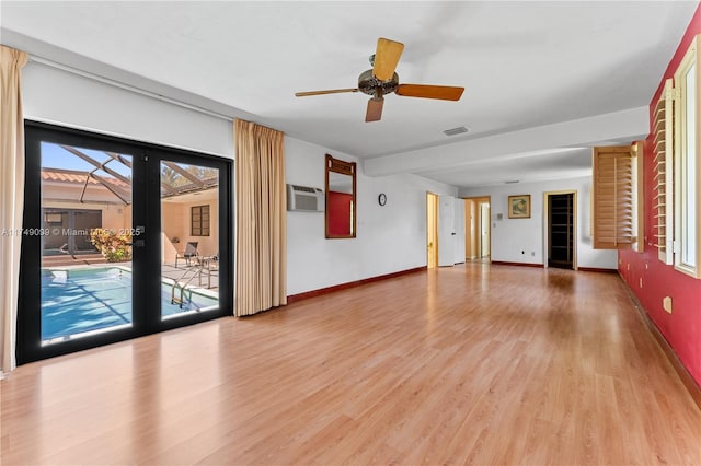 unfurnished living room with baseboards, visible vents, light wood finished floors, ceiling fan, and french doors