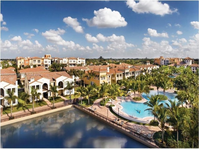 view of pool featuring a residential view and a water view