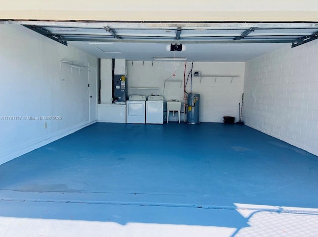 807 Mountbatten Ln, Kissimmee, FL 34758 - garage featuring a sink, heating unit, water heater, and washing machine and clothes dryer