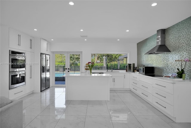 11300 SW 107th Ave, Miami, FL 33176 - kitchen featuring wall chimney range hood, appliances with stainless steel finishes, recessed lighting, light marble finish flooring, and a sink