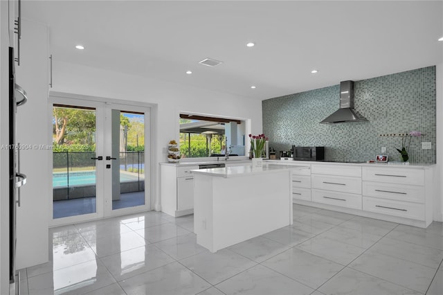 11300 SW 107th Ave, Miami, FL 33176 - kitchen featuring wall chimney exhaust hood, black appliances, healthy amount of natural light, decorative backsplash, and recessed lighting