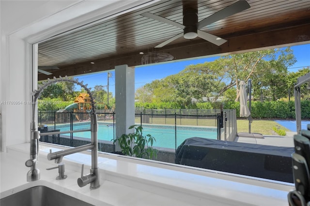 11300 SW 107th Ave, Miami, FL 33176 - view of pool with a ceiling fan, a fenced backyard, and a playground