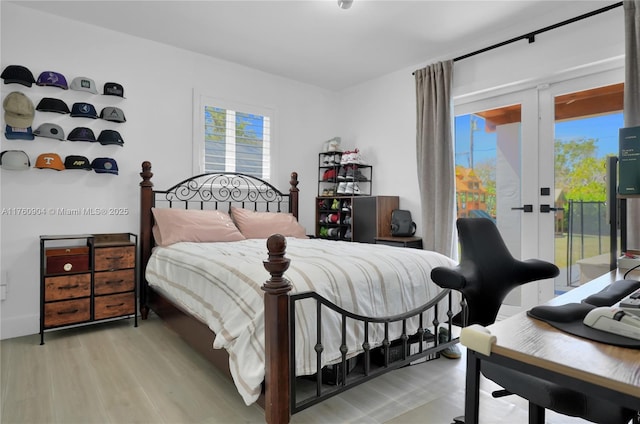 11300 SW 107th Ave, Miami, FL 33176 - bedroom with access to exterior, light wood finished floors, and multiple windows