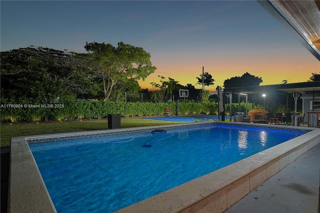 11300 SW 107th Ave, Miami, FL 33176 - pool at dusk featuring an outdoor pool