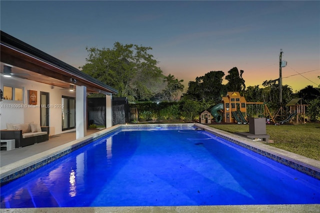 11300 SW 107th Ave, Miami, FL 33176 - pool at dusk with a playground, an outdoor pool, a patio area, and an outdoor living space