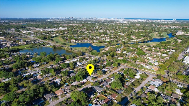 bird's eye view featuring a residential view and a water view