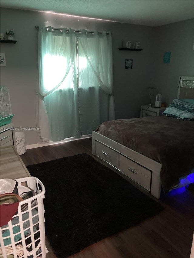 bedroom featuring wood finished floors