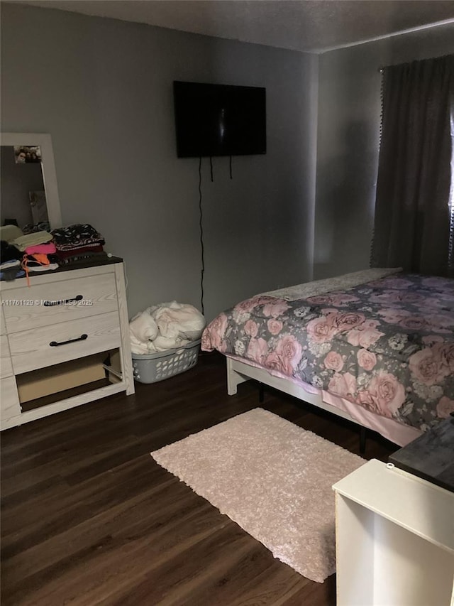 bedroom featuring wood finished floors