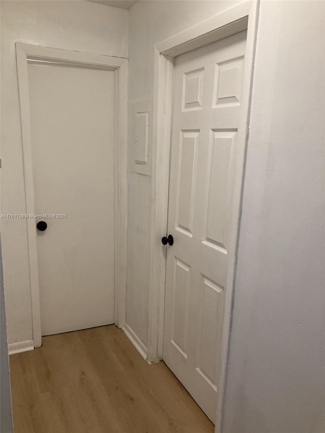 hallway featuring light wood-style flooring