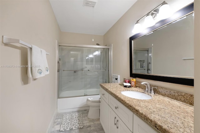 bathroom featuring visible vents, vanity, baseboards, toilet, and enclosed tub / shower combo