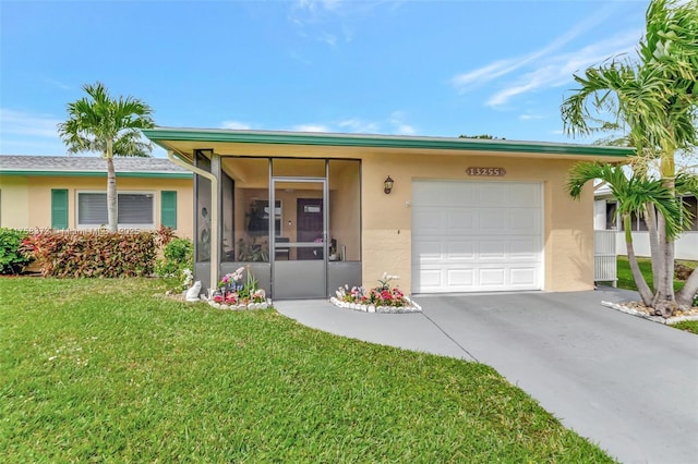 ranch-style house featuring a garage, stucco siding, concrete driveway, and a front lawn