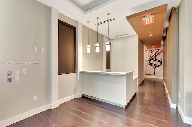 hallway with recessed lighting, baseboards, and dark wood finished floors