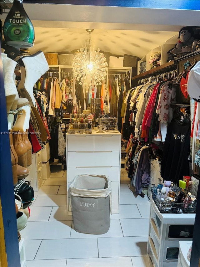 405 SW 73rd Ave, North Lauderdale, FL 33068 - spacious closet featuring light tile patterned floors and a chandelier