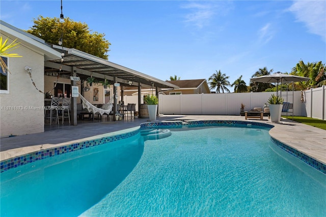 view of swimming pool with a patio area, a fenced in pool, and a fenced backyard