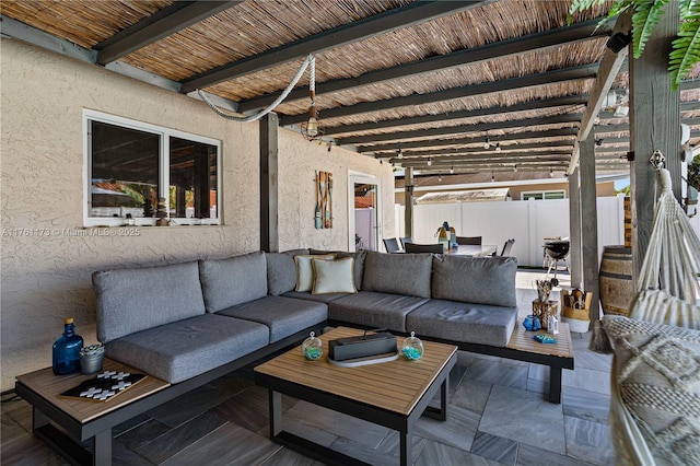 view of patio / terrace with outdoor lounge area and fence