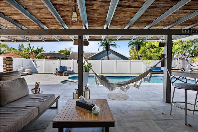 view of patio featuring a fenced in pool, an outdoor hangout area, and a fenced backyard