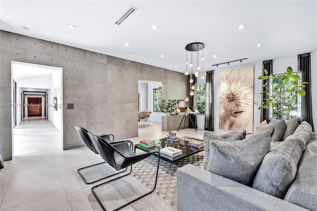 living area featuring light tile patterned floors, visible vents, recessed lighting, and rail lighting