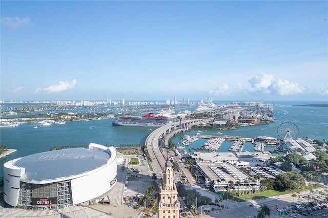 birds eye view of property featuring a water view and a city view