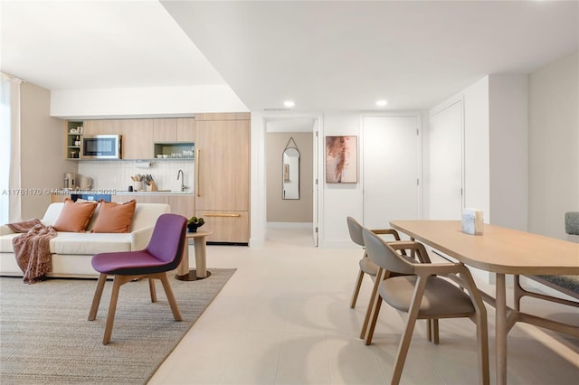 dining area featuring recessed lighting and baseboards