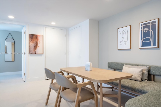 dining space with recessed lighting, breakfast area, and baseboards