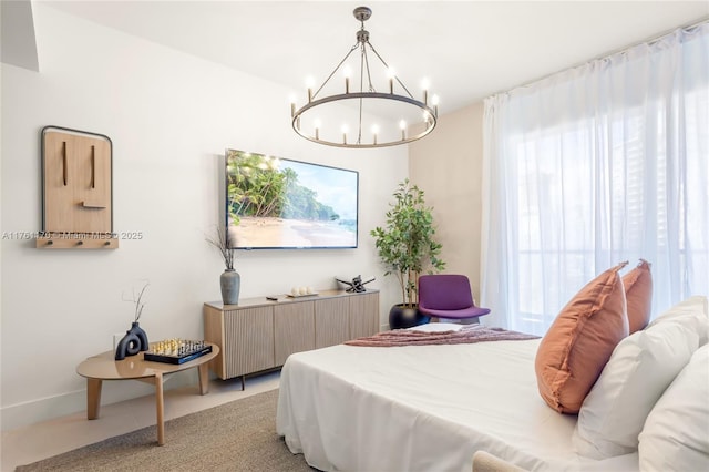 bedroom with an inviting chandelier and light tile patterned floors