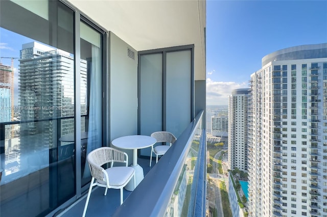 balcony featuring visible vents and a view of city