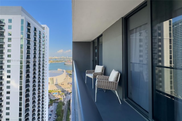 balcony with a city view and a water view