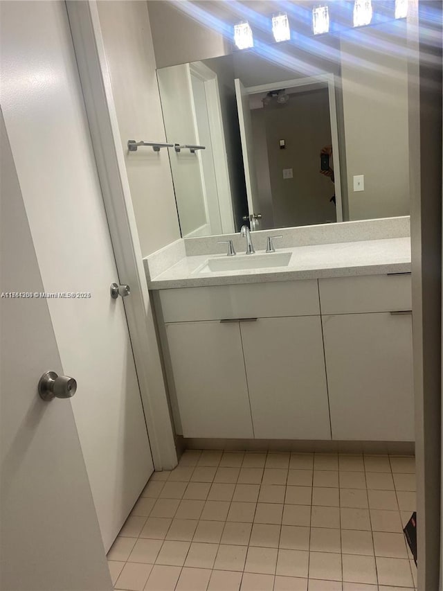 bathroom featuring vanity and tile patterned flooring