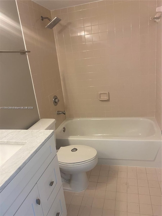 bathroom featuring vanity, shower / tub combination, and toilet