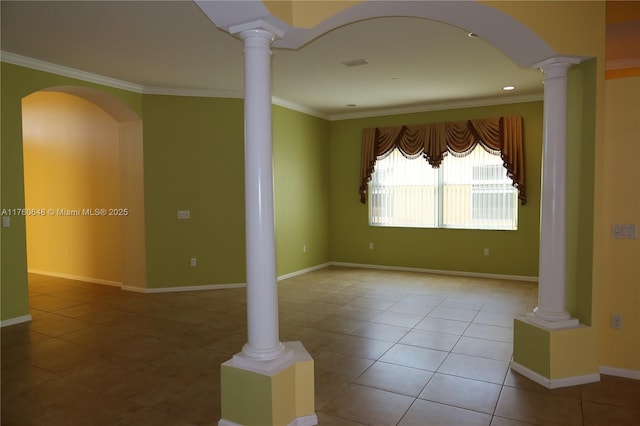 tiled empty room with visible vents, baseboards, crown molding, and ornate columns