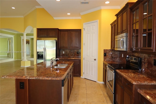 kitchen featuring visible vents, ornate columns, a sink, appliances with stainless steel finishes, and crown molding