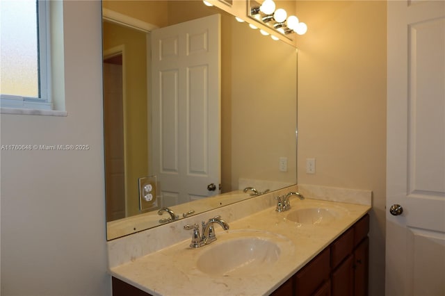 full bathroom featuring double vanity and a sink