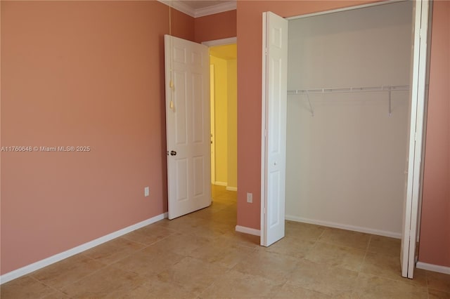 unfurnished bedroom featuring baseboards, a closet, and ornamental molding